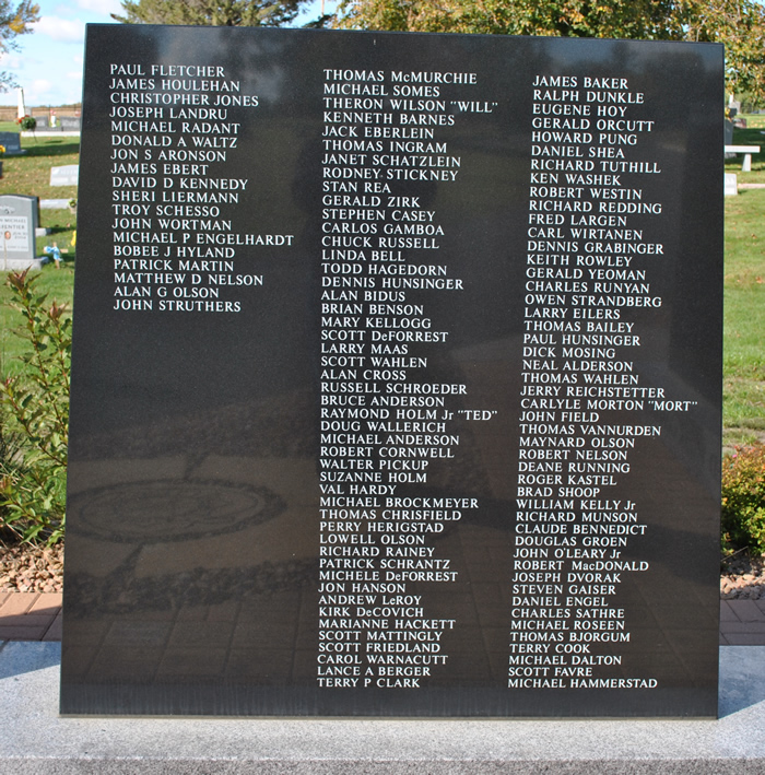 Monument to left of statue